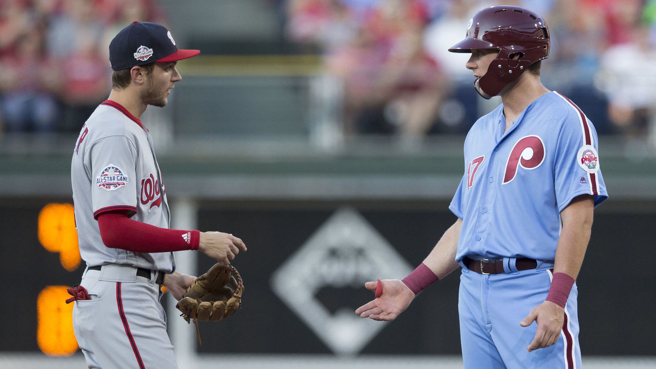 PHILADELPHIA, PA - JUNE 28: Trea Turner #7 of the Washington Nationals talks to Rhys Hoskins #17 of the Philadelphia Phillies at Citizens Bank Park on June 28, 2018 in Philadelphia, Pennsylvania.
