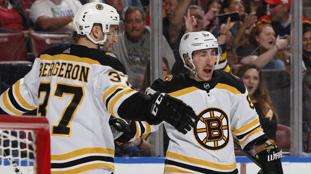 SUNRISE, FL - MARCH 23: Brad Marchand #63 is congratulated by Patrice Bergeron #37 of the Boston Bruins after he scored a second period goal against the Florida Panthers at the BB&T Center on March 23, 2019 in Sunrise, Florida.