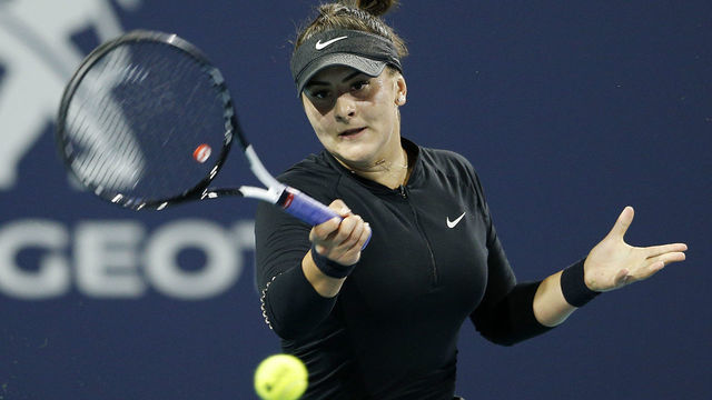 MIAMI GARDENS, FLORIDA - MARCH 23: Bianca Andreescu of Canada returns a shot to Angelique Kerber of Germany during Day 6 of the Miami Open Presented by Itau at Hard Rock Stadium on March 23, 2019 in Miami Gardens, Florida.