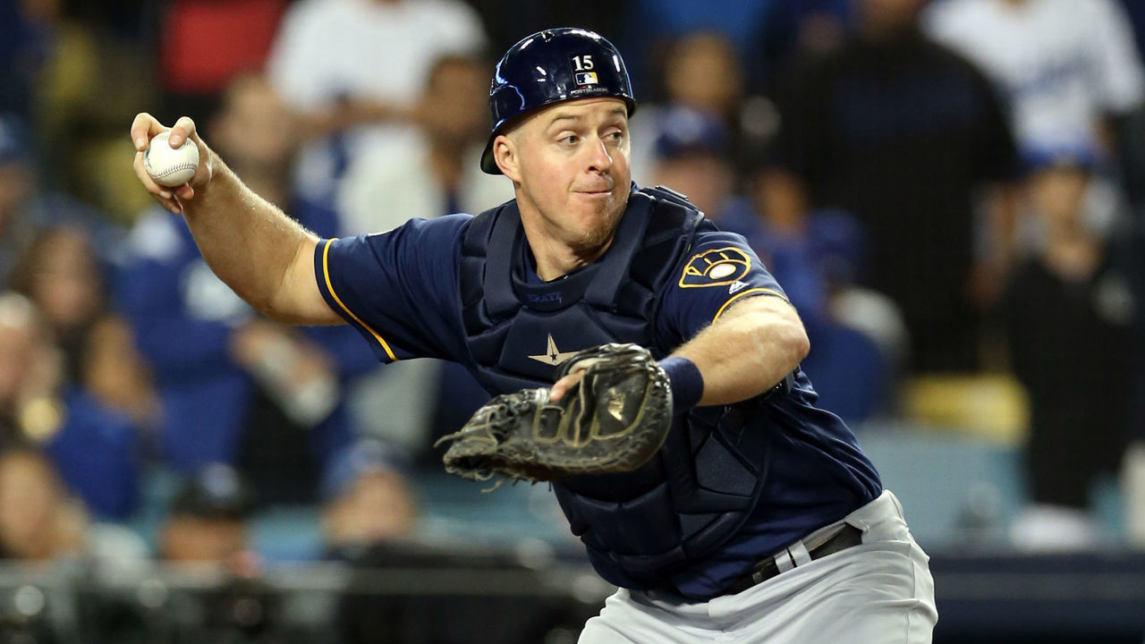 LOS ANGELES, CA - OCTOBER 16: Erik Kratz #15 of the Milwaukee Brewers fields the ball after a wild pitch in the 13th inning of Game 4 of the NLCS against the Los Angeles Dodgers at Dodger Stadium on Tuesday, October 16, 2018 in Los Angeles, California.