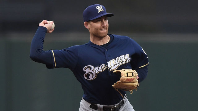 SAN FRANCISCO, CA - JULY 26: Brad Miller #10 of the Milwaukee Brewers throws to first base throwing the runner out against the San Francisco Giants in the bottom of the first inning at AT&T Park on July 26, 2018 in San Francisco, California.