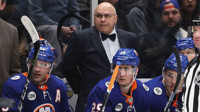 UNIONDALE, NEW YORK - MARCH 09: Barry Trotz of the New York Islanders sports a bowtie in honor of Bill Torrey during the game between the New York Islanders and the Philadelphia Flyers at NYCB Live's Nassau Coliseum on March 09, 2019 in Uniondale, New York.