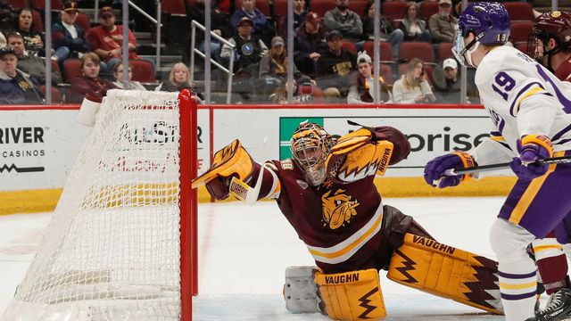 GLENDALE, AZ - DECEMBER 28: Minnesota-Duluth Bulldogs goaltender Hunter Shepard (32) dives for the puck during the college hockey game between the Minnesota-Duluth Bulldogs and the Minnesota State Mavericks on December 28, 2018 at Gila River Arena in Glendale, Arizona.