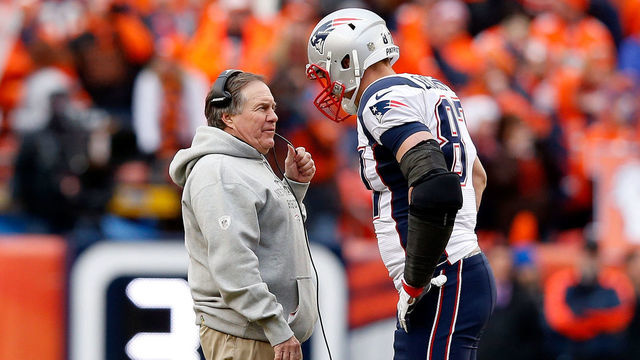 DENVER, CO - JANUARY 24: Head coach Bill Belichick of the New England Patriots speaks to Rob Gronkowski #87 in the fourth quarter against the Denver Broncos in the AFC Championship game at Sports Authority Field at Mile High on January 24, 2016 in Denver, Colorado.