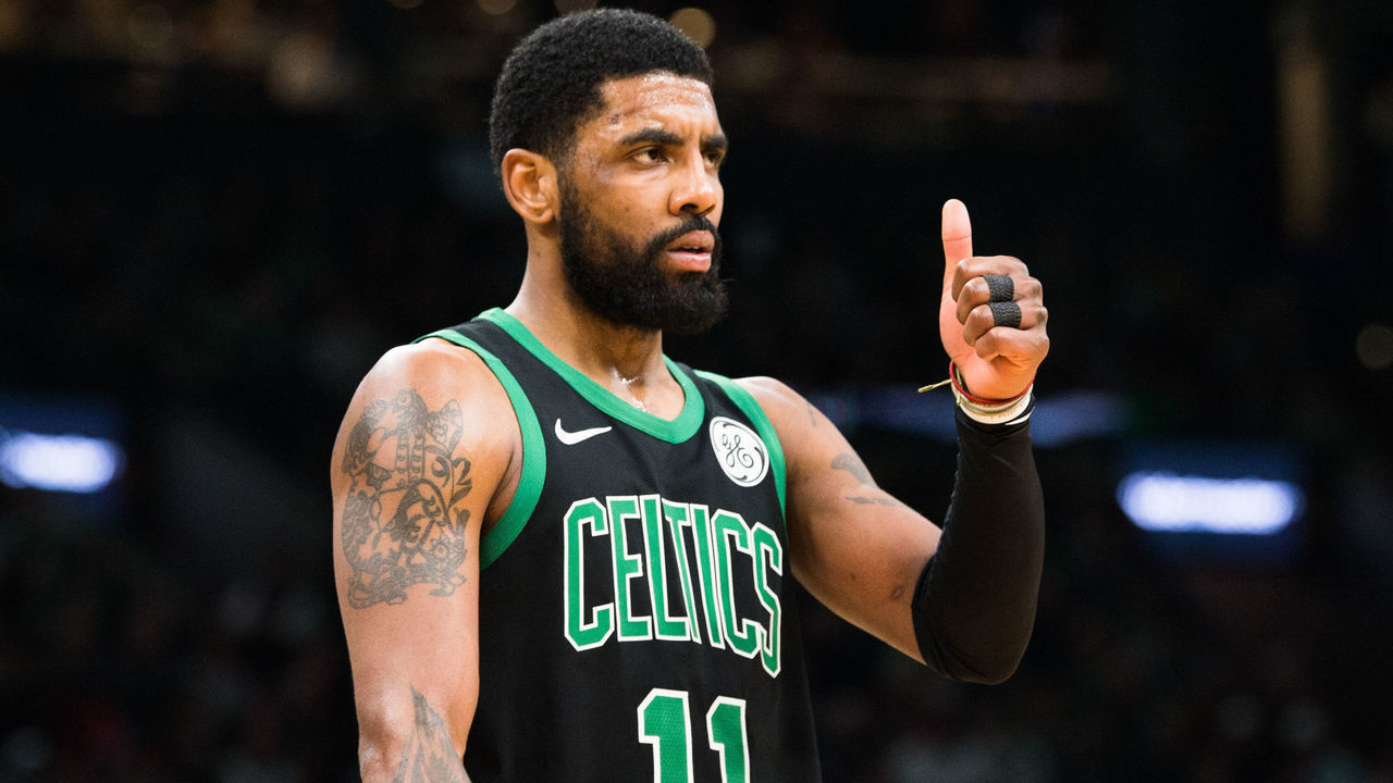 BOSTON, MA - MARCH 24: Kyrie Irving #11 of the Boston Celtics gives a thumbs up during a game against the San Antonio Spurs at TD Garden on March 24, 2019 in Boston, Massachusetts.