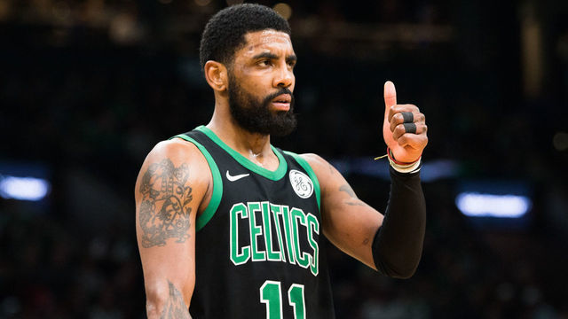 BOSTON, MA - MARCH 24: Kyrie Irving #11 of the Boston Celtics gives a thumbs up during a game against the San Antonio Spurs at TD Garden on March 24, 2019 in Boston, Massachusetts.