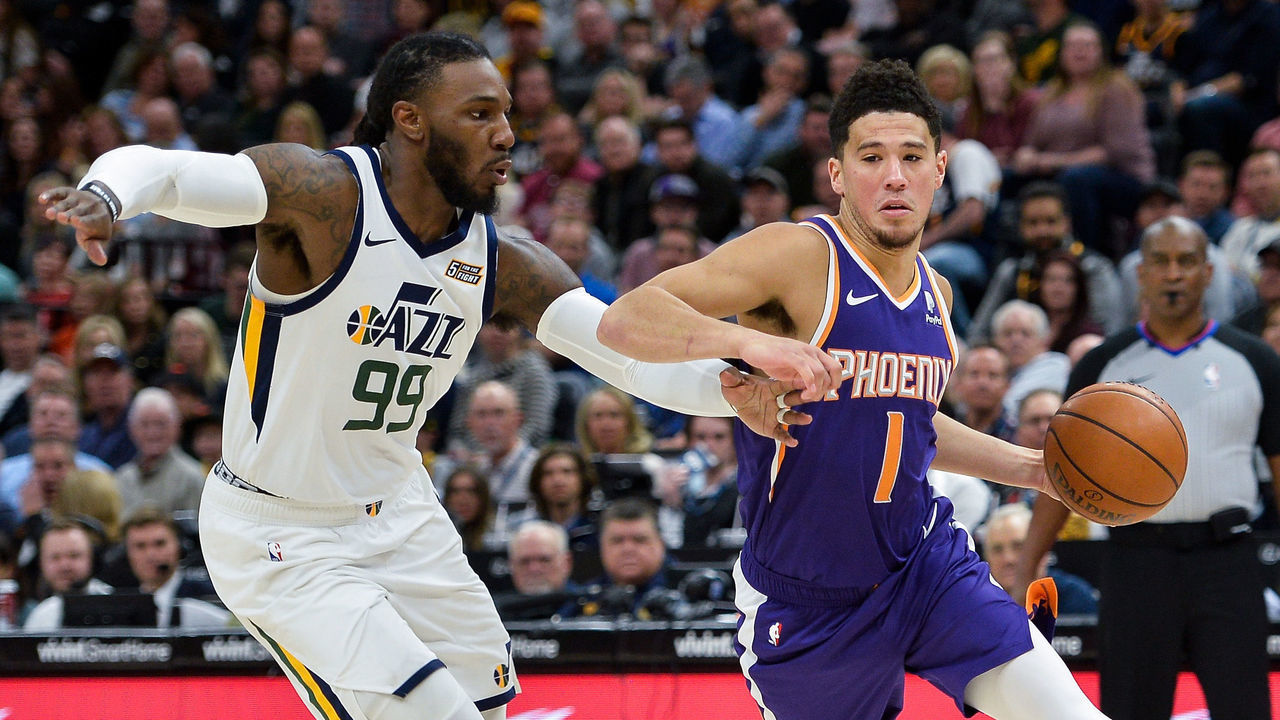 SALT LAKE CITY, UT - MARCH 25: Devin Booker #1 of the Phoenix Suns drives past Jae Crowder #99 of the Utah Jazz during a game at Vivint Smart Home Arena on March 25, 2019 in Salt Lake City, Utah.