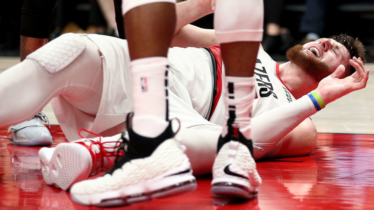 PORTLAND, OR - MARCH 25: Jusuf Nurkic #27 of the Portland Trail Blazers reacts after suffering an apparent broken leg against the Brooklyn Nets in double overtime during their game at Moda Center on March 25, 2019 in Portland, Oregon.