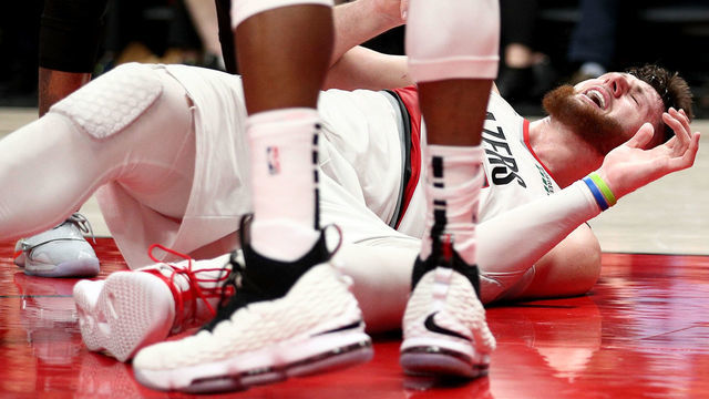 PORTLAND, OR - MARCH 25: Jusuf Nurkic #27 of the Portland Trail Blazers reacts after suffering an apparent broken leg against the Brooklyn Nets in double overtime during their game at Moda Center on March 25, 2019 in Portland, Oregon.