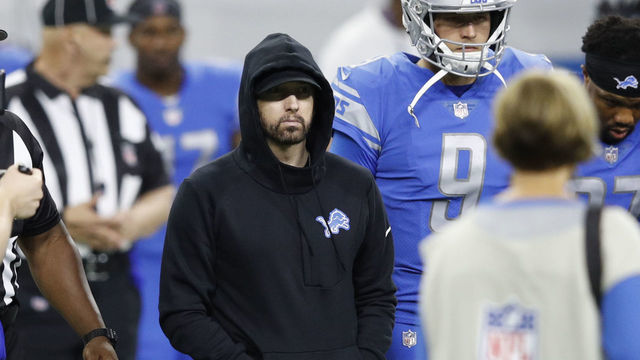 DETROIT, MI - SEPTEMBER 10: Hip-hop artist Eminem takes the field for the coin toss prior to the game between the New York Jets and Detroit Lions at Ford Field on September 10, 2018 in Detroit, Michigan.