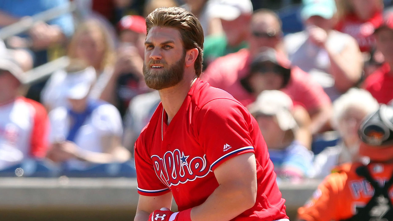 CLEARWATER, FL - MARCH 24: Bryce Harper (3) of the Phillies strikes out swinging and takes off his batting equipment before taking right field during the spring training game between the Baltimore Orioles and the Philadelphia Phillies on March 24, 2019 at the Spectrum Field in Clearwater, Florida.