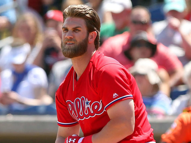 CLEARWATER, FL - MARCH 24: Bryce Harper (3) of the Phillies strikes out swinging and takes off his batting equipment before taking right field during the spring training game between the Baltimore Orioles and the Philadelphia Phillies on March 24, 2019 at the Spectrum Field in Clearwater, Florida.