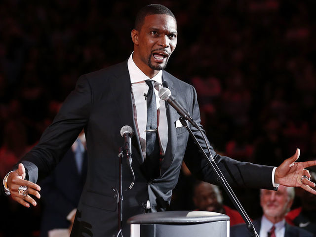 MIAMI, FLORIDA - MARCH 26: Former Miami Heat player Chris Bosh reacts during his jersey retirement ceremony at halftime of the game between the Miami Heat and the Orlando Magic at American Airlines Arena on March 26, 2019 in Miami, Florida.