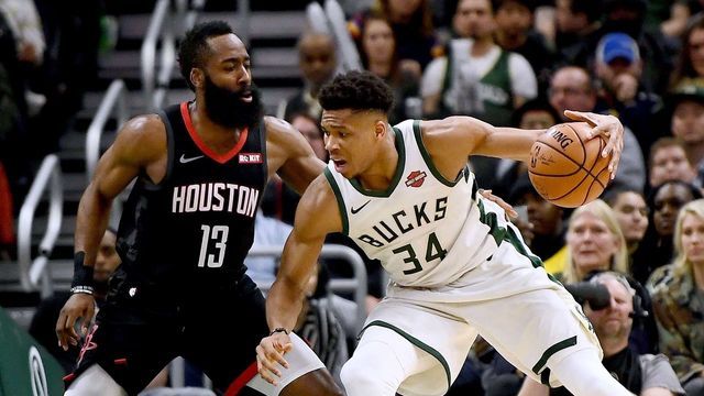 MILWAUKEE, WISCONSIN - MARCH 26: Giannis Antetokounmpo #34 of the Milwaukee Bucks is defended by James Harden #13 of the Houston Rockets during the second half of a game at Fiserv Forum on March 26, 2019 in Milwaukee, Wisconsin.
