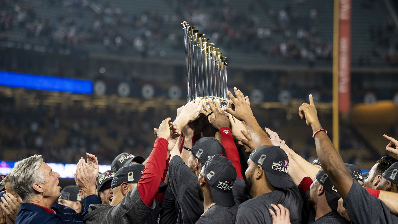 LOS ANGELES, CA - OCTOBER 28: Members of the Boston Red Sox hold up the World Series trophy after winning the 2018 World Series in game five against the Los Angeles Dodgers on October 28, 2018 at Dodger Stadium in Los Angeles, California.