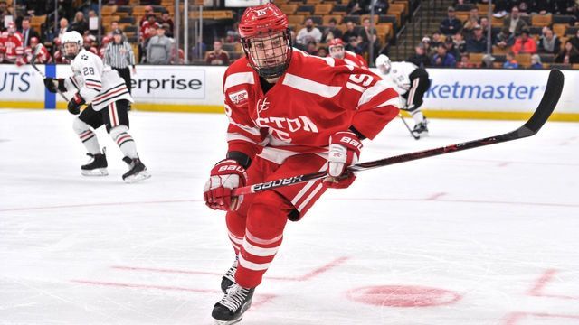 BOSTON, MA - MARCH 22: Boston University Terriers forward Shane Bowers (15) scrambles for the loose puck along the boards. During the Boston University Terriers game against the Northeastern Huskies on March 22, 2019 at TD Garden in Boston, MA.