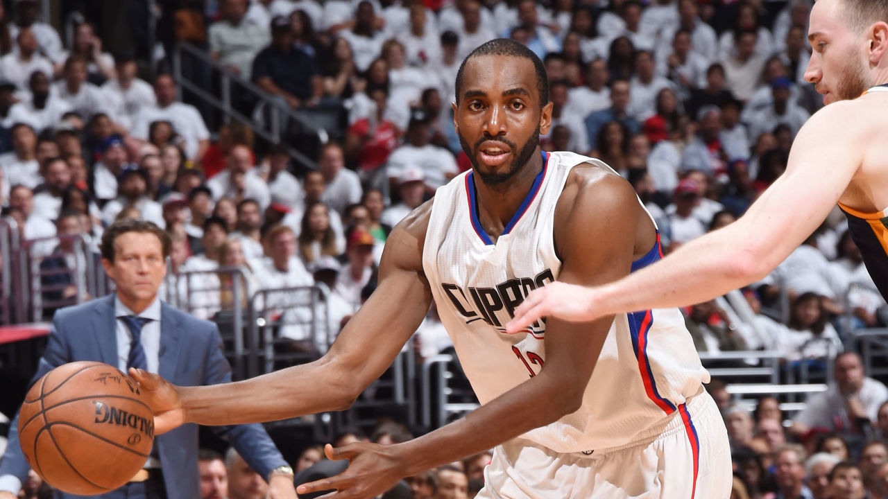 LOS ANGELES, CA - APRIL 18: Luc Richard Mbah a Moute #12 of the LA Clippers looks to pass the ball against the Utah Jazz during Game Two of the Western Conference Quarterfinals of the 2017 NBA Playoffs on April 18, 2017 at STAPLES Center in Los Angeles, California. NOTE TO USER: User expressly acknowledges and agrees that, by downloading and/or using this photograph, user is consenting to the terms and conditions of the Getty Images License Agreement. Mandatory Copyright Notice: Copyright 2017 NBAE