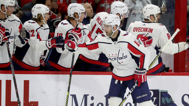 RALEIGH, NC - MARCH 28: Brett Connolly #10 of the Washington Capitals celebrates with teammates after scoring a goal during an NHL game against the Carolina Hurricanes on March 28, 2019 at PNC Arena in Raleigh, North Carolina.