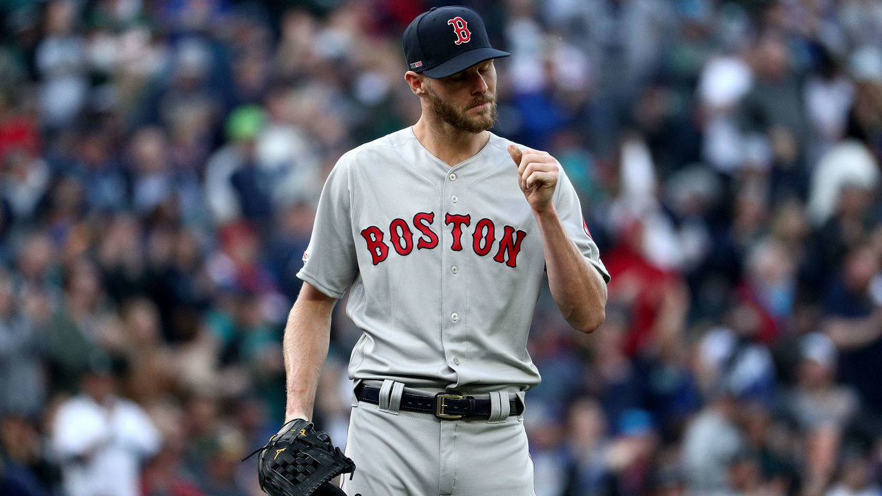 SEATTLE, WA - MARCH 28: Chris Sale #41 of the Boston Red Sox reacts after giving up a solo home run to Edwin Encarnacion #10 of the Seattle Mariners in the third inning during their Opening Day game at T-Mobile Park on March 28, 2019 in Seattle, Washington.