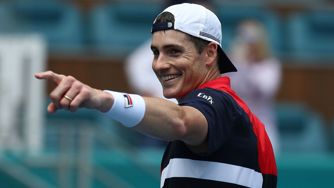 MIAMI GARDENS, FLORIDA - MARCH 29: John Isner celebrates match point against Felix Auger Aliassime of Canada during day 12 of the Miami Open presented by Itau at Hard Rock Stadium on March 29, 2019 in Miami Gardens, Florida.