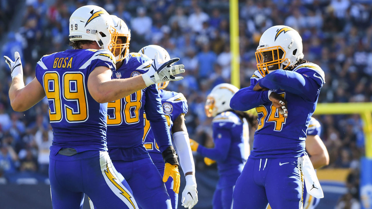 CARSON, CA - NOVEMBER 25: Defensive end Joey Bosa #99 of the Los Angeles Chargers celebrates his sack with defensive end Melvin Ingram #54 in the second quarter against the Arizona Cardinals at StubHub Center on November 25, 2018 in Carson, California.