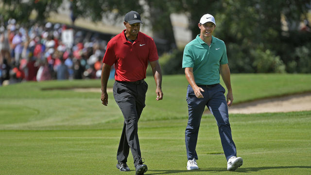 ATLANTA, GA - SEPTEMBER 23: Tiger Woods and Rory McIlroy of Northern Ireland walk down the fairway of the first hole during the final round of the TOUR Championship at East Lake Golf Club on September 23, 2018, in Atlanta, Georgia.