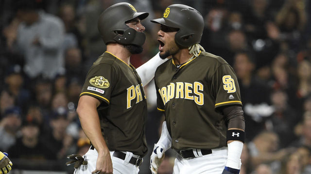 SAN DIEGO, CA - MARCH 29: Fernadndo Tatis Jr. #23 of the San Diego Padres, right, celebrates with Eric Hosmer #30 after scoring during the second inning against the San Francisco Giants Petco Park March 29, 2019 in San Diego, California.