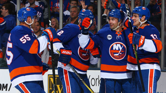UNIONDALE, NY - MARCH 30: Jordan Eberle #7 of the New York Islanders celebrates his first period goal with teamates Anders Lee #27 and Mathew Barzal #13 against the Buffalo Sabres at NYCB Live's Nassau Coliseum on March 30, 2019 in Uniondale, New York.
