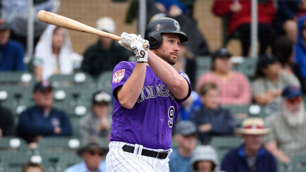 SCOTTSDALE, ARIZONA - MARCH 11: Daniel Murphy #9 of the Colorado Rockies singles against the Oakland Athletics during the spring training game at Salt River Fields at Talking Stick on March 11, 2019 in Scottsdale, Arizona.