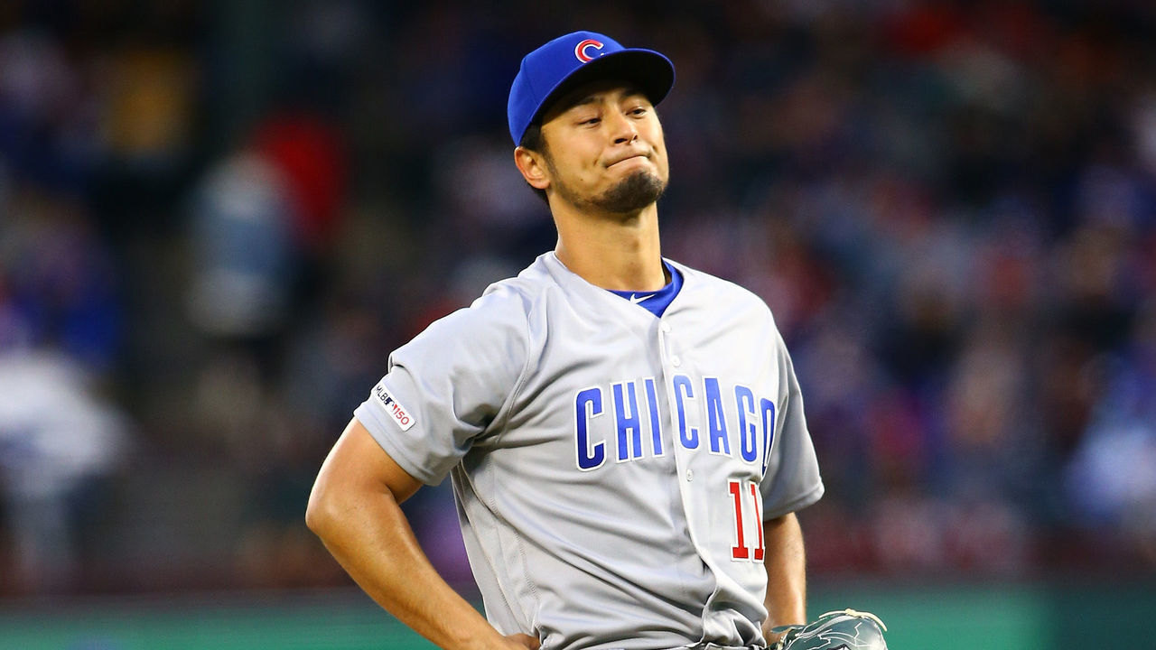 ARLINGTON, TX - MARCH 30: Yu Darvish #11 of the Chicago Cubs reacts after walking the batter in the first inning against the Texas Rangers at Globe Life Park in Arlington on March 30, 2019 in Arlington, Texas.