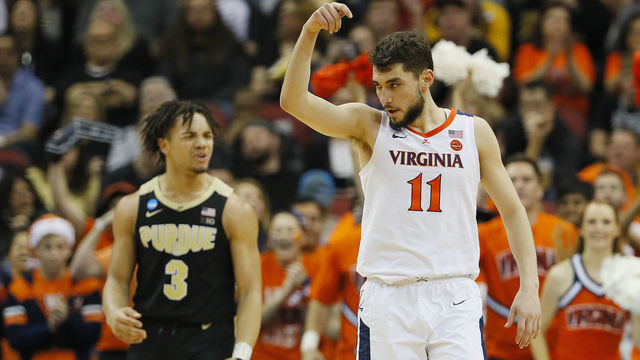 LOUISVILLE, KENTUCKY - MARCH 30: Ty Jerome #11 of the Virginia Cavaliers reacts after a foul was called on Carsen Edwards #3 of the Purdue Boilermakers during the second half of the 2019 NCAA Men's Basketball Tournament South Regional at KFC YUM! Center on March 30, 2019 in Louisville, Kentucky.