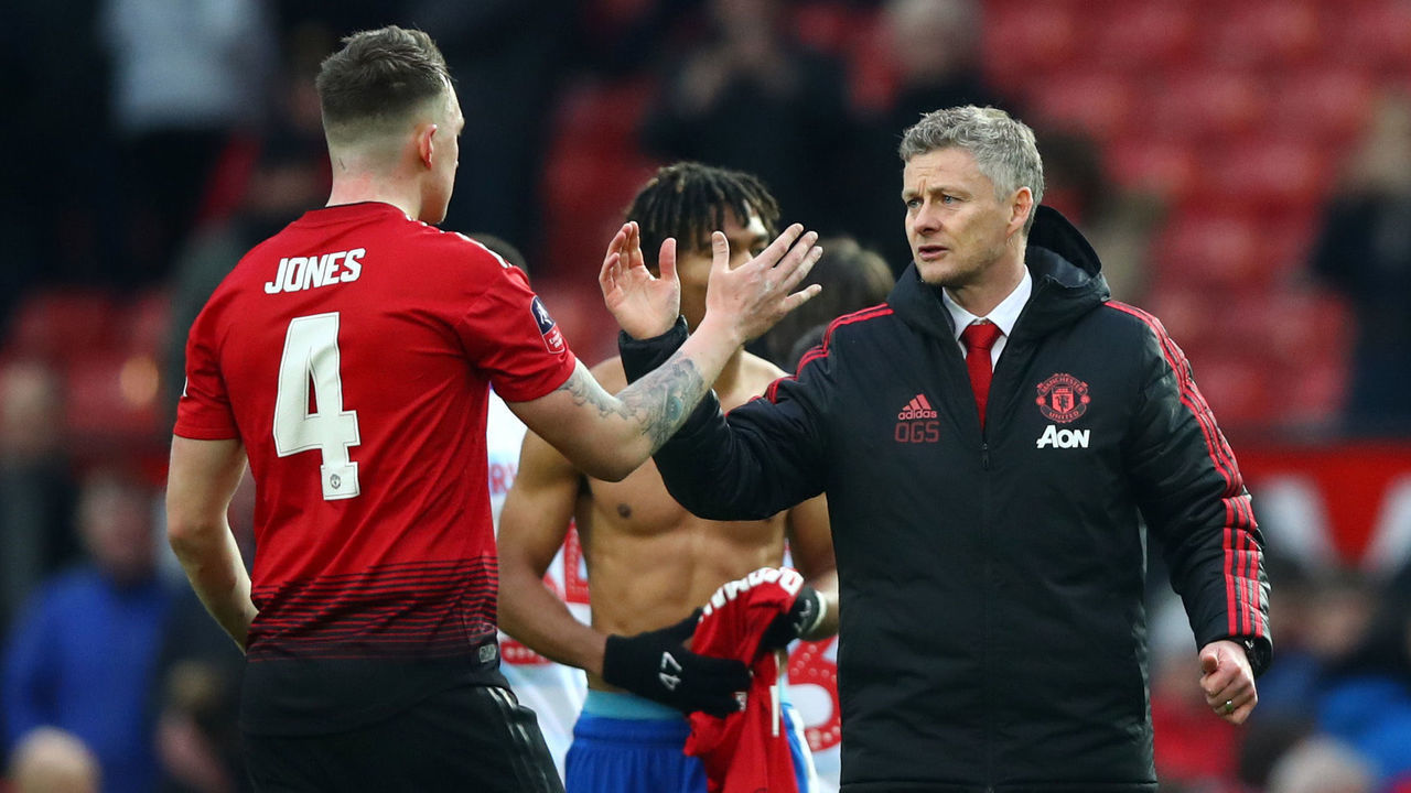 MANCHESTER, ENGLAND - JANUARY 05: Ole Gunnar Solskjaer, Interim Manager of Manchester United celebrates with Phil Jones of Manchester United following their sides victory in the FA Cup Third Round match between Manchester United and Reading at Old Trafford on January 5, 2019 in Manchester, United Kingdom.