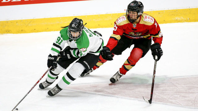 TORONTO, ON - MARCH 25 - Jenna McParland (left) of the Thunder tries to get away from Madison Woo of the Red Star during the 2nd period of CWHL action as the The Markham Thunder play the Kunlun Red Star for the Clarkson Cup at Ricoh Coliseum on March 25, 2018. (Carlos Osorio/Toronto Star via Getty Images)