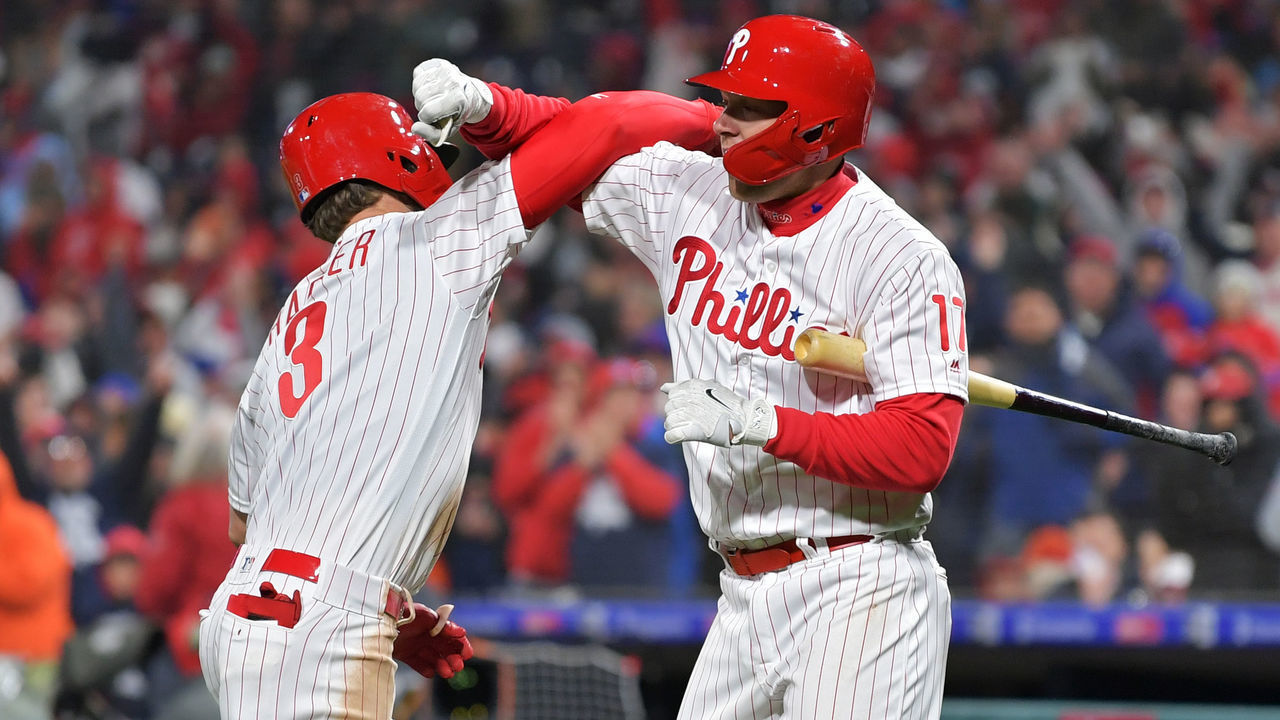 PHILADELPHIA, PA - MARCH 31: Bryce Harper #3 and Rhys Hoskins #17 of the Philadelphia Phillies celebrate Harpers home run in the seventh inning against the Atlanta Braves at Citizens Bank Park on March 31, 2019 in Philadelphia, Pennsylvania.