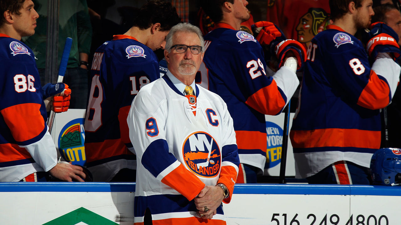 UNIONDALE, NY - DECEMBER 13: Former New York Islander Clark Gillies is honored prior to the game against the Chicago Blackhawks at the Nassau Veterans Memorial Coliseum on December 13, 2014 in Uniondale, New York.