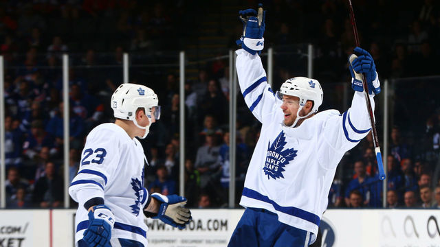 UNIONDALE, NY - APRIL 01: Calle Rosen #48 of the Toronto Maple Leafs celebrates his second period goal with Travis Dermott #23 against the New York Islanders at NYCB Live's Nassau Coliseum on April 1, 2019 in Uniondale, New York.