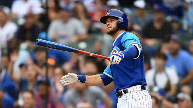 CHICAGO, IL - AUGUST 24: David Bote #13 of the Chicago Cubs hits a walk off home run against the Cincinnati Reds during the tenth inning at Wrigley Field on August 24, 2018 in Chicago, Illinois.