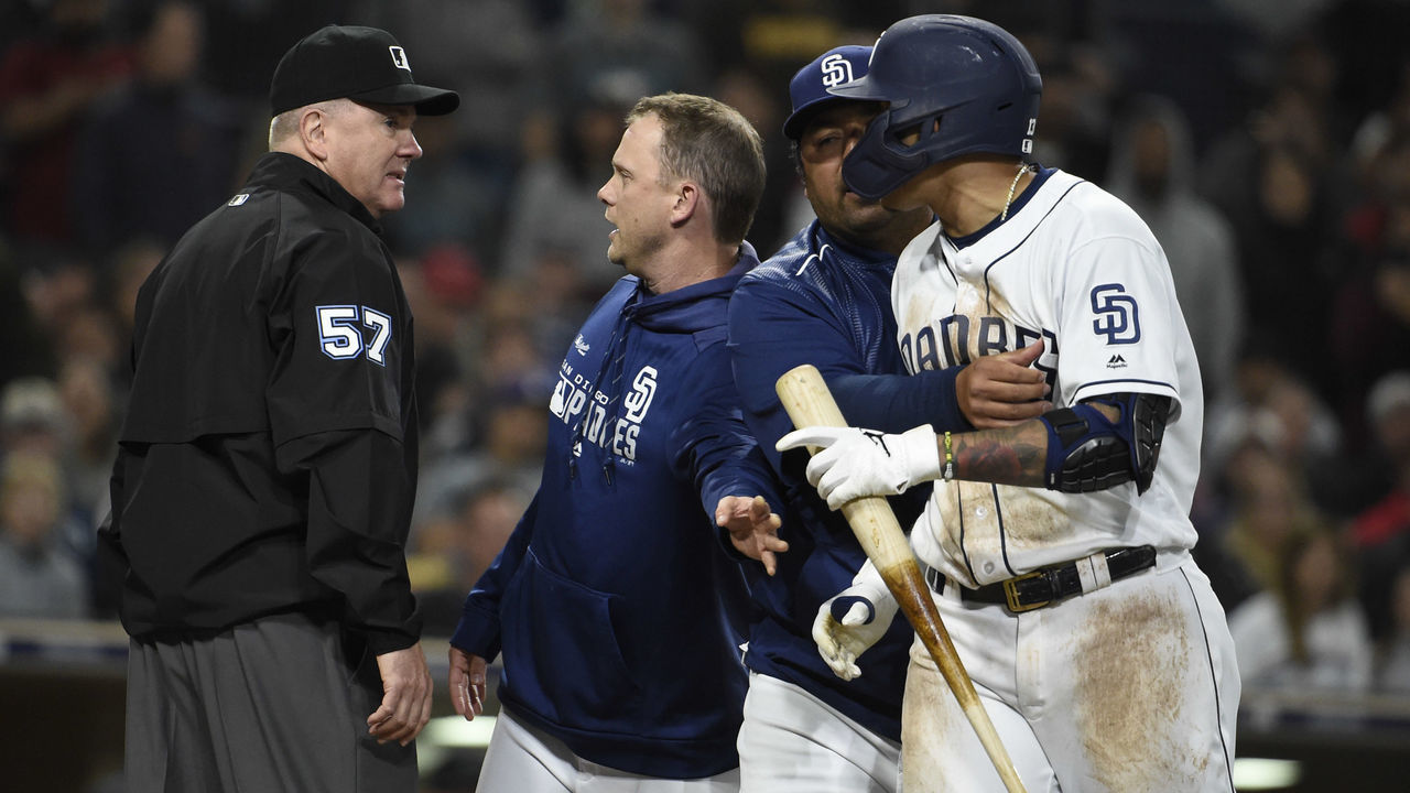 SAN DIEGO, CA - APRIL 2: San Diego Padres manager Andy Green argues with umpire Mike Everitt as bench coach Rod Barajas holds back Manny Machado #13 after Green was ejected from the game during the sixth inning of a baseball game against the Arizona Diamondbacks at Petco Park April 2, 2019 in San Diego, California.