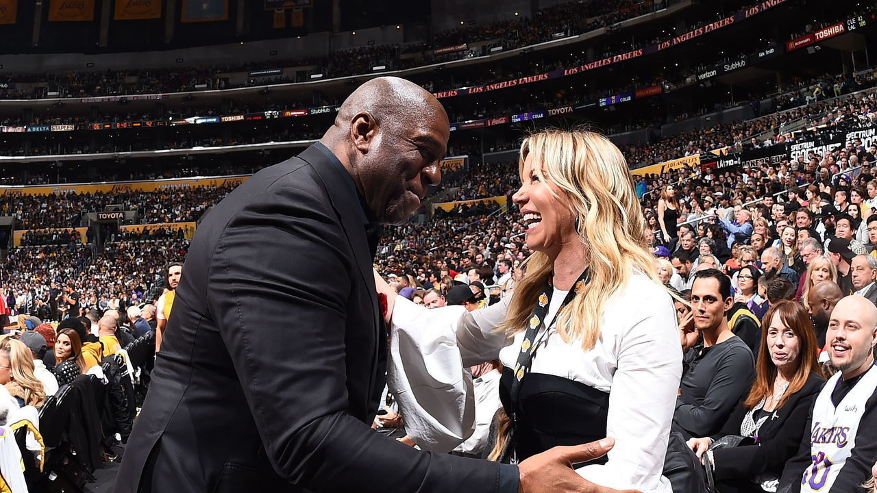 LOS ANGELES, CA - MARCH 11: Magic Johnson and Jeanie Buss exchange a hug during the game between the Los Angeles Lakers and Cleveland Cavaliers on March 11, 2018 at STAPLES Center in Los Angeles, California. NOTE TO USER: User expressly acknowledges and agrees that, by downloading and/or using this Photograph, user is consenting to the terms and conditions of the Getty Images License Agreement. Mandatory Copyright Notice: Copyright 2018 NBAE