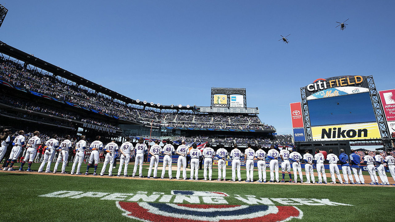 NEW YORK, NEW YORK - APRIL 04: The New York Mets stand for the National Anthem against the Washington Nationals at the Mets Home Opening game at Citi Field on April 04, 2019 in New York City.