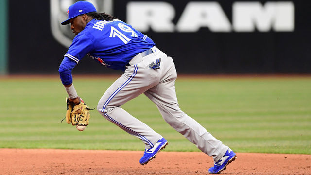 CLEVELAND, OHIO - APRIL 04: Second baseman Alen Hanson #19 of the Toronto Blue Jays bobbles a ball hit by Tyler Naquin #30 of the Cleveland Indians during the third inning at Progressive Field on April 04, 2019 in Cleveland, Ohio.
