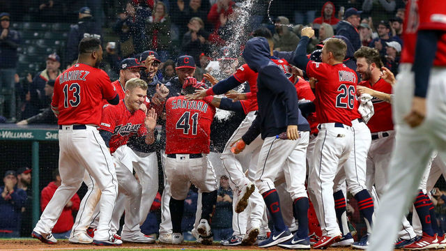 CLEVELAND, OH - APRIL 05: Cleveland Indians first baseman Carlos Santana (41) is mobbed by teammates as he crosses home plate after hitting a walk-off home run to end the Major League Baseball game between the Toronto Blue Jays and Cleveland Indians on April 5, 2019, at Progressive Field in Cleveland, OH.