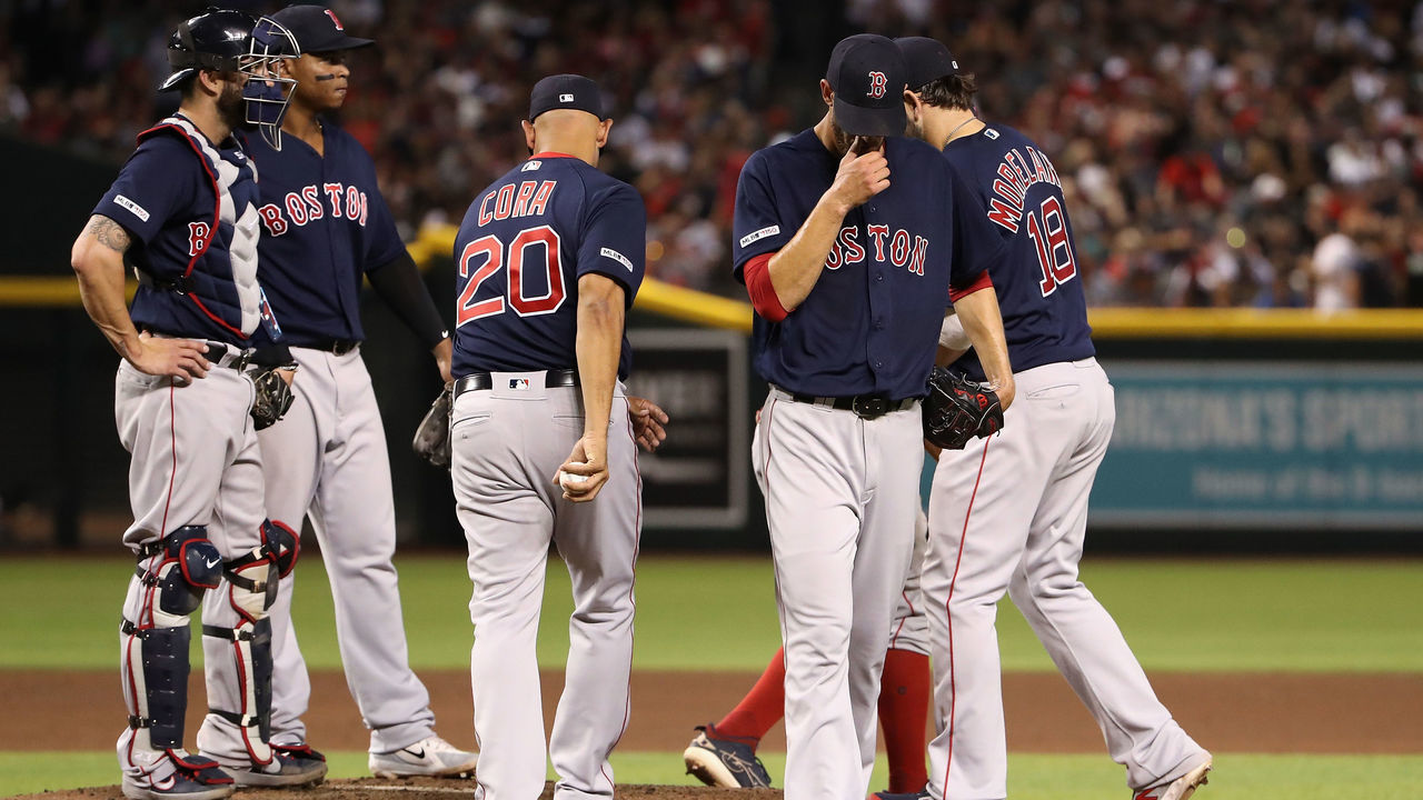 PHOENIX, ARIZONA - APRIL 05: Starting pitcher Rick Porcello #22 of the Boston Red Sox is removed by manager Alex Cora #20 during the fifth inning of the MLB game against the Arizona Diamondbacks at Chase Field on April 05, 2019 in Phoenix, Arizona.