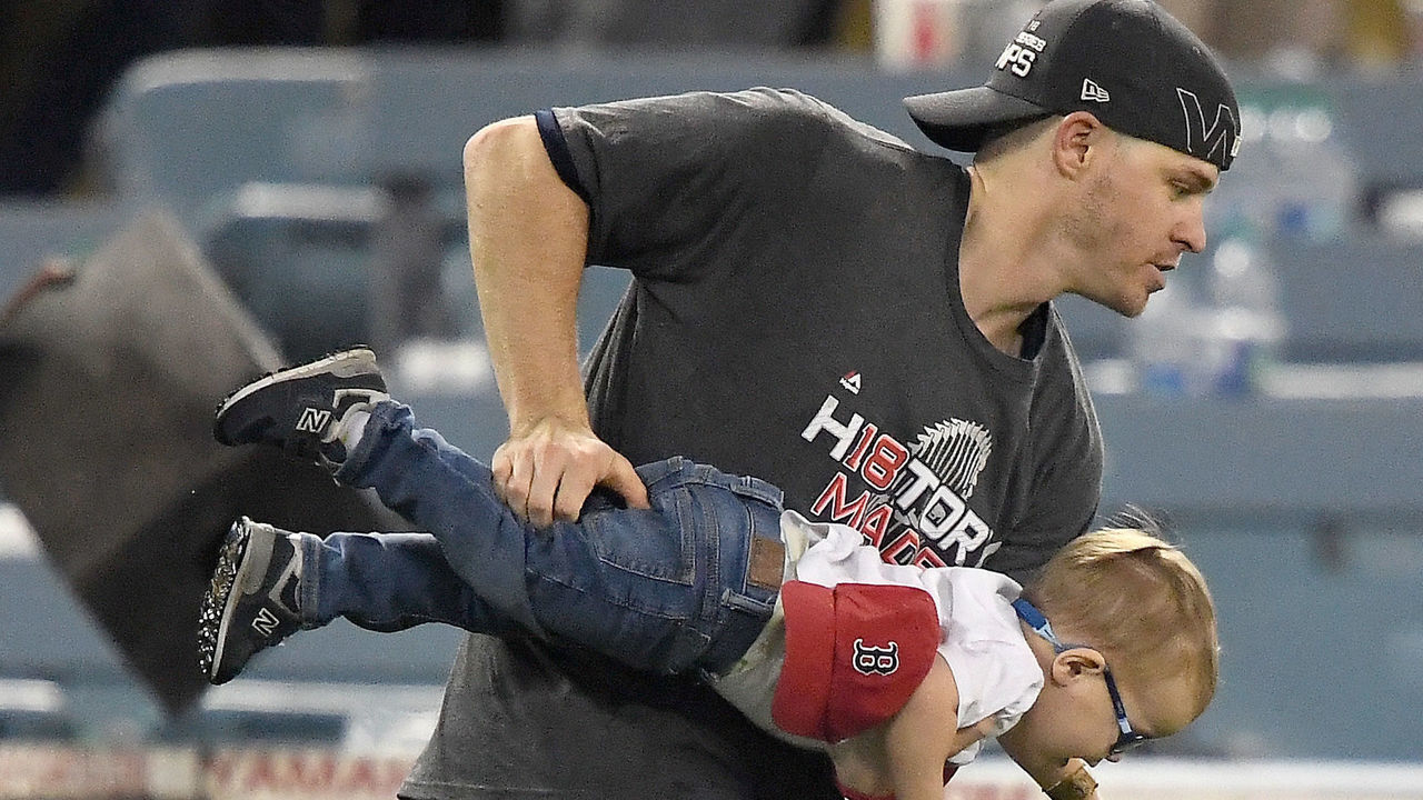 LOS ANGELES, CA - OCTOBER 28: Brock Holt #12 of the Boston Red Sox celebrates with his son after his team's 5-1 win over the Los Angeles Dodgers in Game Five of the 2018 World Series at Dodger Stadium on October 28, 2018 in Los Angeles, California.