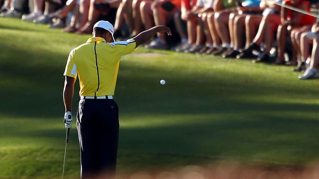 AUGUSTA, GA - APRIL 12: Tiger Woods of the United States drops his ball after he hits it into the water on the 15th hole during the second round of the 2013 Masters Tournament at Augusta National Golf Club on April 12, 2013 in Augusta, Georgia.
