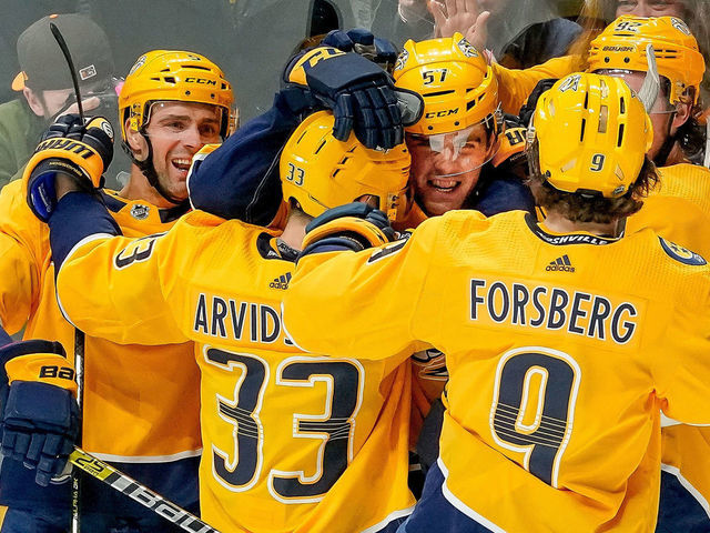 NASHVILLE, TN - APRIL 6: Dante Fabbro #57 of the Nashville Predators celebrates his first NHL goal with teammates against the Chicago Blackhawks at Bridgestone Arena on April 6, 2019 in Nashville, Tennessee.