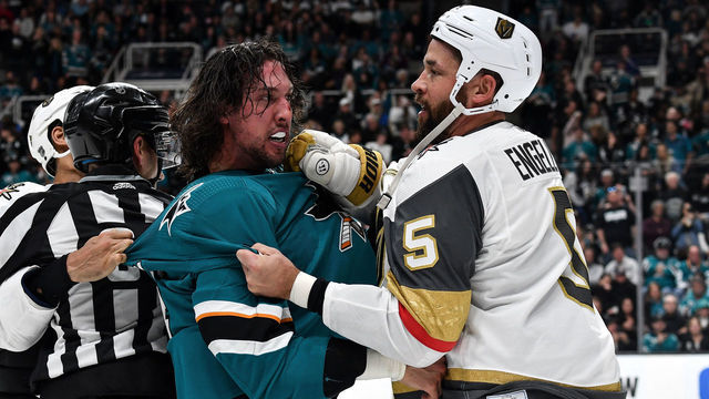 SAN JOSE, CA - MARCH 30: Brenden Dillon #4 of the San Jose Sharks throws hands with Deryk Engelland #5 of the Vegas Golden Knights at SAP Center on March 30, 2019 in San Jose, California