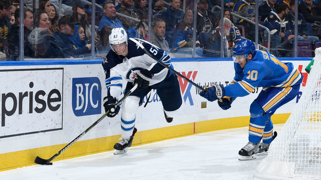 ST. LOUIS, MO - NOVEMBER 24: Tyler Myers #57 of the Winnipeg Jets controls the puck as Brayden Schenn #10 of the St. Louis Blues pressures at Enterprise Center on November 24, 2018 in St. Louis, Missouri.