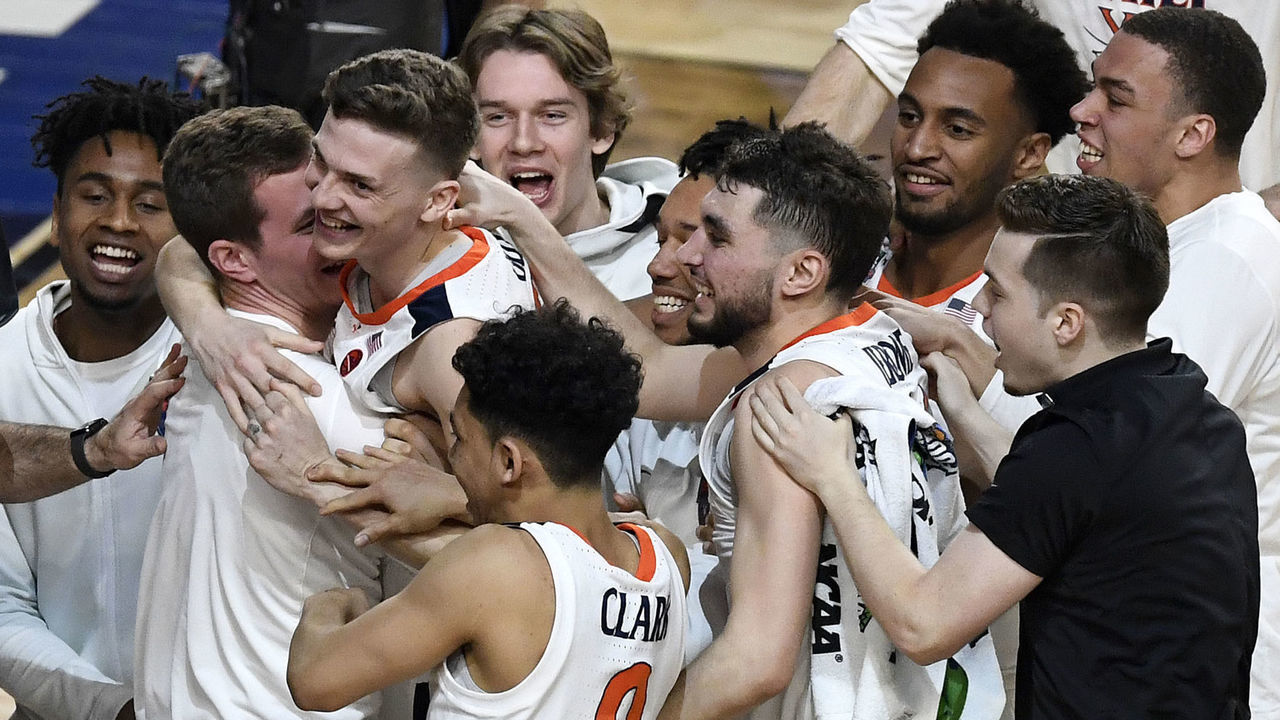 MINNEAPOLIS, MINNESOTA - APRIL 06: Kyle Guy #5 of the Virginia Cavaliers celebrates with teammates after defeating the Auburn Tigers 63-62 during the 2019 NCAA Final Four semifinal at U.S. Bank Stadium on April 6, 2019 in Minneapolis, Minnesota.