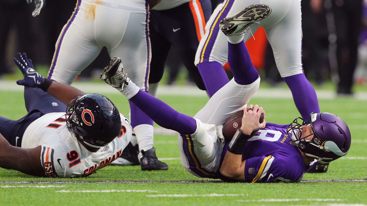 MINNEAPOLIS, MN - DECEMBER 30: Kirk Cousins #8 of the Minnesota Vikings gets sacked in the first quarter by Eddie Goldman #91 of the Chicago Bears at U.S. Bank Stadium on December 30, 2018 in Minneapolis, Minnesota.